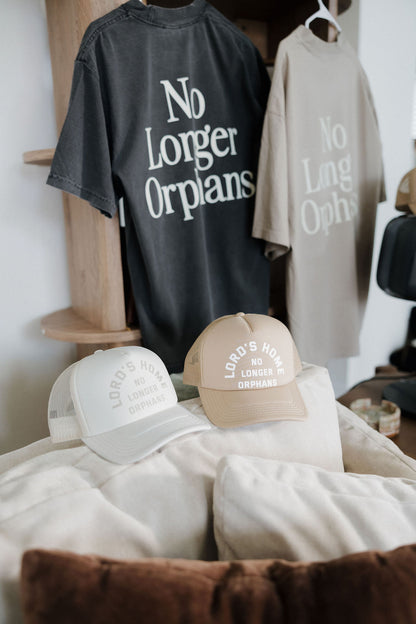 No Longer Orphans Trucker Hat — Off White